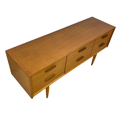 880 - A teak 6 drawer sideboard designed by Frank Guille for Austinsuite. Mid Century. 1960’s. 143.5 x 42 ... 