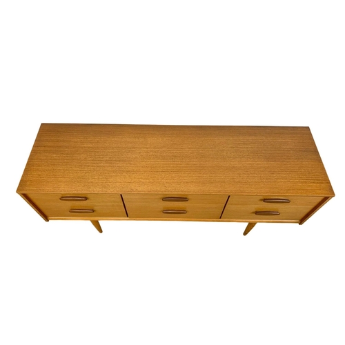 880 - A teak 6 drawer sideboard designed by Frank Guille for Austinsuite. Mid Century. 1960’s. 143.5 x 42 ... 