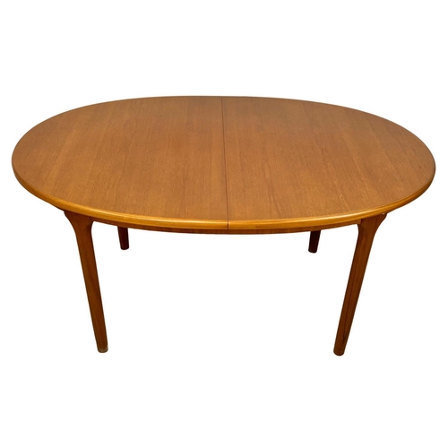 882 - A McIntosh teak extending dining table. Mid Century. Extended 197 x 95 x 76cm. Closed 152cm.