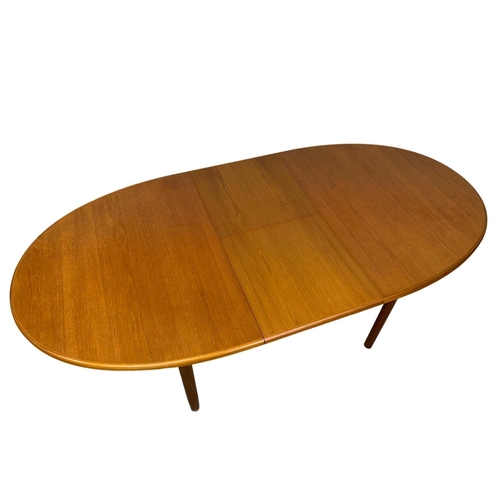 882 - A McIntosh teak extending dining table. Mid Century. Extended 197 x 95 x 76cm. Closed 152cm.