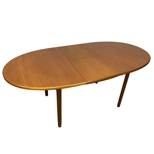 882 - A McIntosh teak extending dining table. Mid Century. Extended 197 x 95 x 76cm. Closed 152cm.