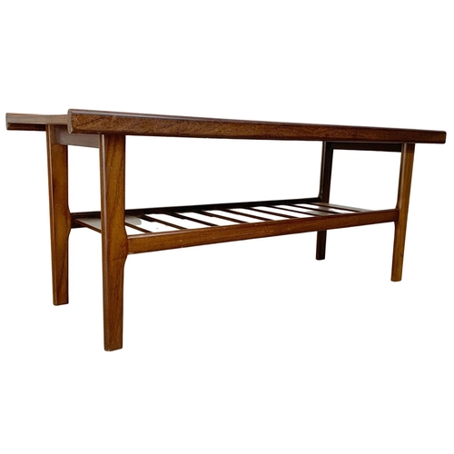 883 - A teak coffee table by Myer with slatted shelf. 122 x 45 x 49cm