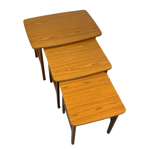 886a - A large teak nest of 3 tables by Schreiber. Mid Century.