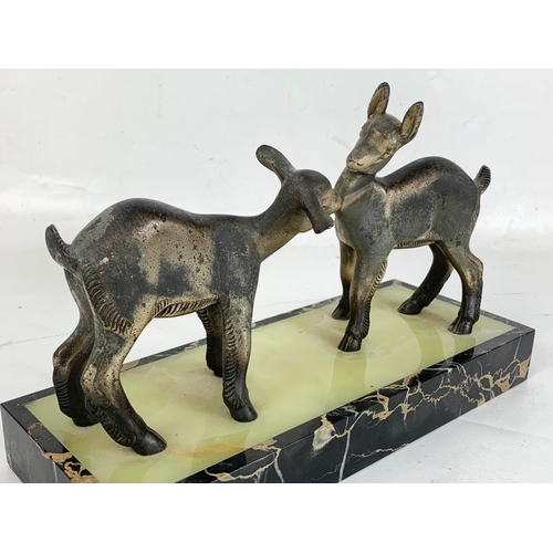 89 - A large early 20th century French Art Deco lambs on a marble base. Circa 1920. 32.5 x 12.5 x 21cm.