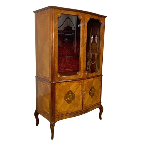 892 - An 18th century style French inlaid display cabinet. 93 x 47 x 152.5cm.