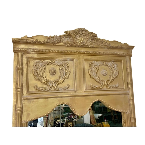 897 - A very large 18th century style French gilt framed mirror. 123.5 x 254cm.