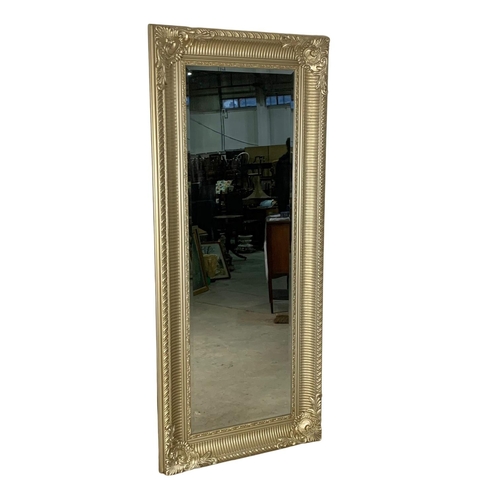 897a - A very large ornate gilt framed mirror. 80 x 190.5cm