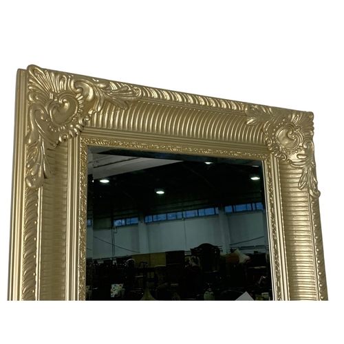 897a - A very large ornate gilt framed mirror. 80 x 190.5cm