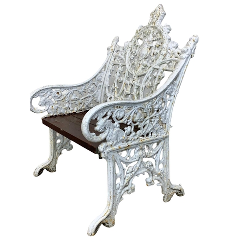 898 - A 3 piece late 19th century heavy cast iron garden suite. Including an ornate bench and a pair of ch... 