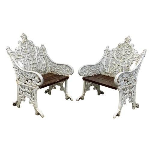 898 - A 3 piece late 19th century heavy cast iron garden suite. Including an ornate bench and a pair of ch... 