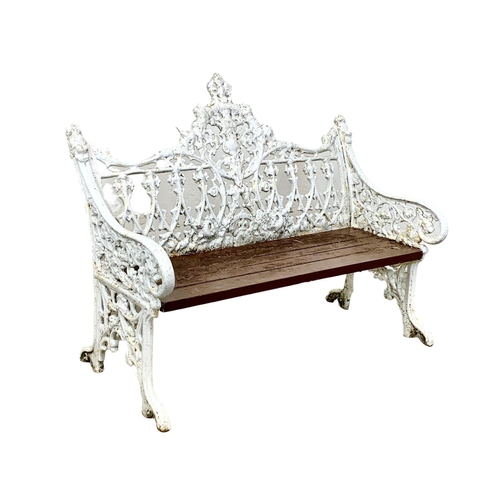 898 - A 3 piece late 19th century heavy cast iron garden suite. Including an ornate bench and a pair of ch... 