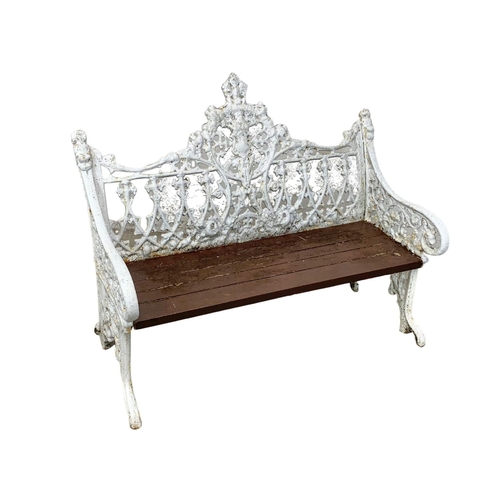 898 - A 3 piece late 19th century heavy cast iron garden suite. Including an ornate bench and a pair of ch... 