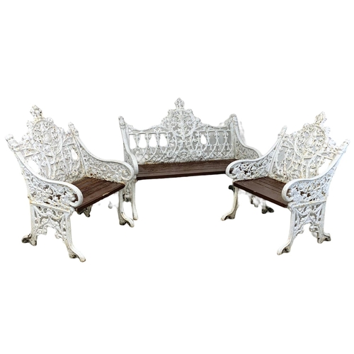 898 - A 3 piece late 19th century heavy cast iron garden suite. Including an ornate bench and a pair of ch... 