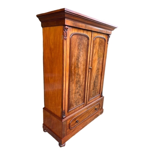 899 - A large Victorian mahogany double door wardrobe with shelves and drawer. Circa 1860-1870. 139 x 65 x... 