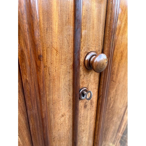 899 - A large Victorian mahogany double door wardrobe with shelves and drawer. Circa 1860-1870. 139 x 65 x... 