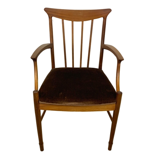 900 - A Mid Century teak armchair.