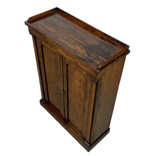 904 - A William IV rosewood side cabinet with gallery back and shelving. Circa 1830’s. 75.5 x 30.5 x 104.5... 