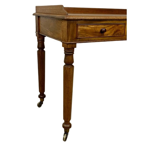 917 - A large early Victorian mahogany side table with gallery back and 3 drawers. Circa 1840-50. 122 x 60... 