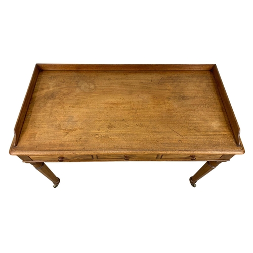 917 - A large early Victorian mahogany side table with gallery back and 3 drawers. Circa 1840-50. 122 x 60... 