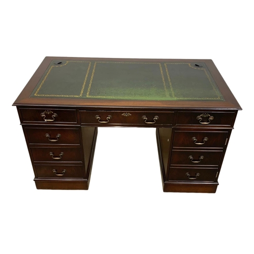 928 - A Georgian style mahogany leather top pedestal desk. 137 x 76 x 76.5cm