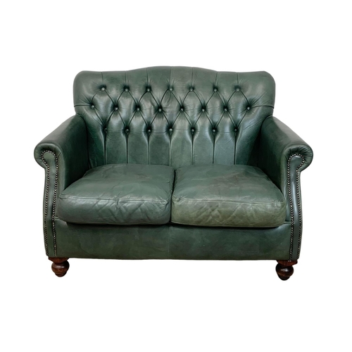 932 - A 2 piece Thomas Lloyd leather suite. 2 seater sofa and an armchair. Sofa measures 120cm