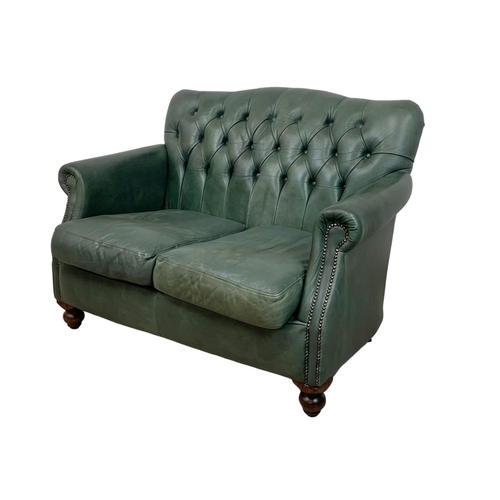 932 - A 2 piece Thomas Lloyd leather suite. 2 seater sofa and an armchair. Sofa measures 120cm