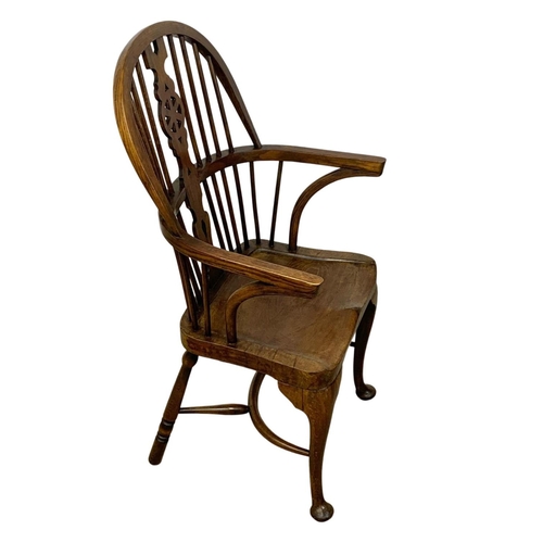 933 - An early 20th century elm and beech Windsor armchair. 61 x 50 x 106cm