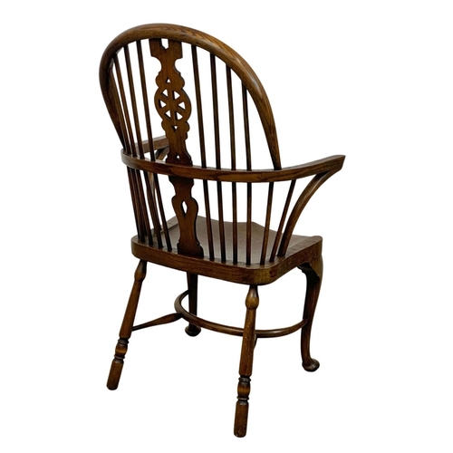 933 - An early 20th century elm and beech Windsor armchair. 61 x 50 x 106cm