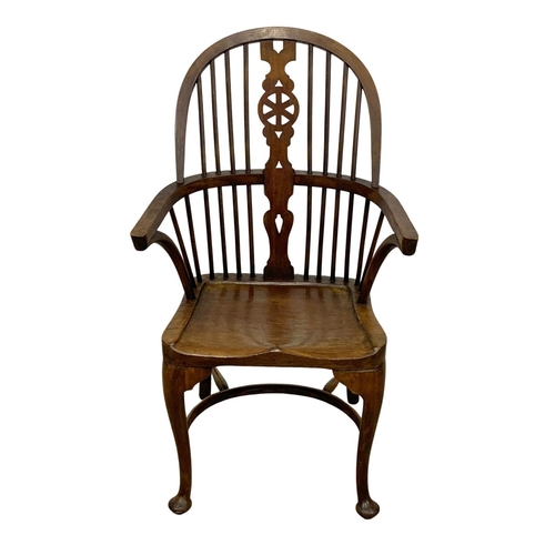 933 - An early 20th century elm and beech Windsor armchair. 61 x 50 x 106cm