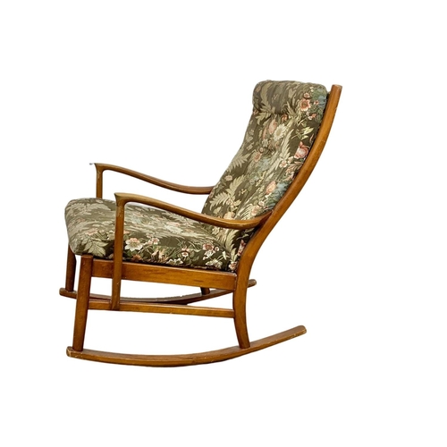 934 - A vintage Parker Knoll beech rocking chair. Model 1016-19.