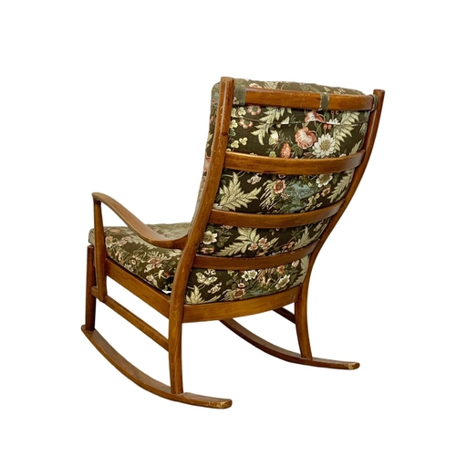 934 - A vintage Parker Knoll beech rocking chair. Model 1016-19.