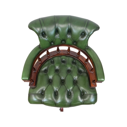 940 - A deep button green leather swivel captains desk chair