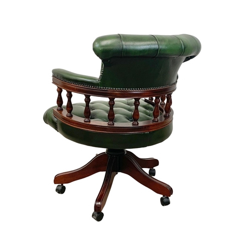 940 - A deep button green leather swivel captains desk chair