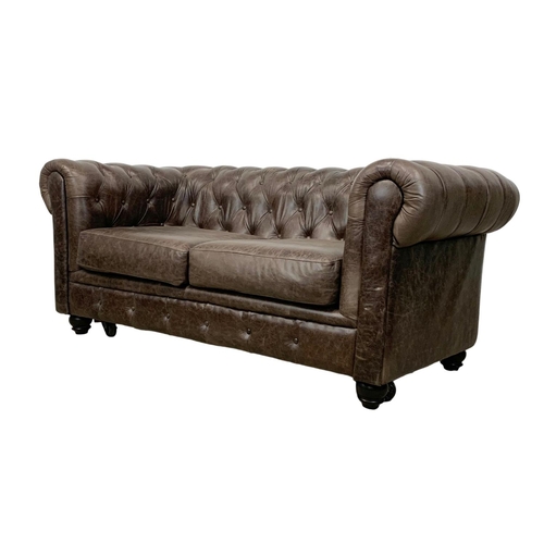 958 - A deep button brown leather Chesterfield sofa. 185 x 96 x 79cm