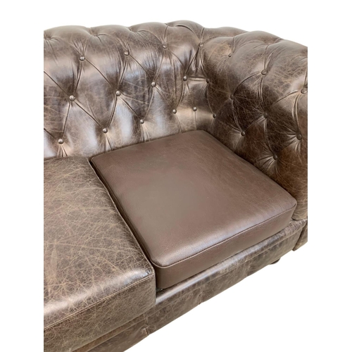 959 - A large deep button brown leather Chesterfield sofa. 223 x 91 x 83cm