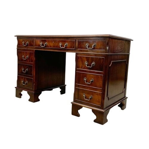 966 - A Georgian style inlaid mahogany pedestal desk. 123.5 x 61 x 77.5cm.