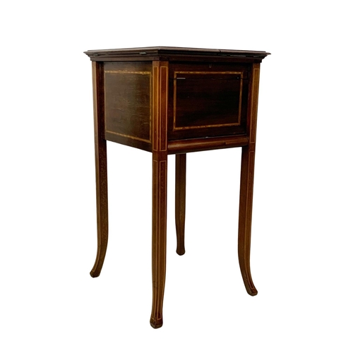 973 - An Edwardian inlaid mahogany smokers cabinet with a Royal Doulton Lambeth humidor. 38 x 43 x 76cm