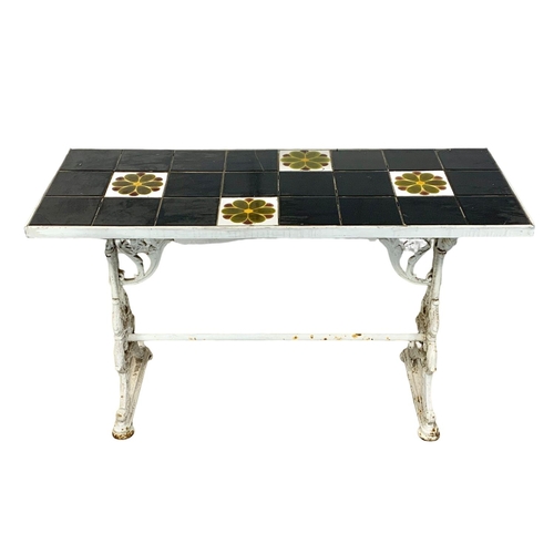 977 - A Victorian cast iron garden table with a 1950s tile top, 125cm x 48.5cm x 76cm