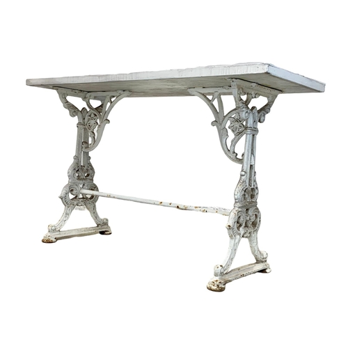 977 - A Victorian cast iron garden table with a 1950s tile top, 125cm x 48.5cm x 76cm