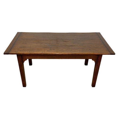 988 - An 18th century style oak farmhouse table with square tapered legs. 168.5 x 83.5 x 77cm