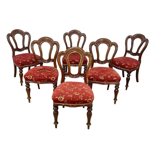 995 - A Victorian mahogany telescopic dining table and 6 balloon back chairs. Circa 1870. Extended 217cm. ... 