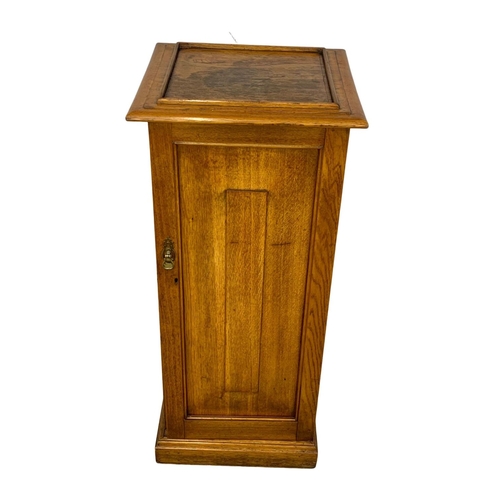 998 - A tall Victorian oak bedside. 42 x 40 x 96cm.