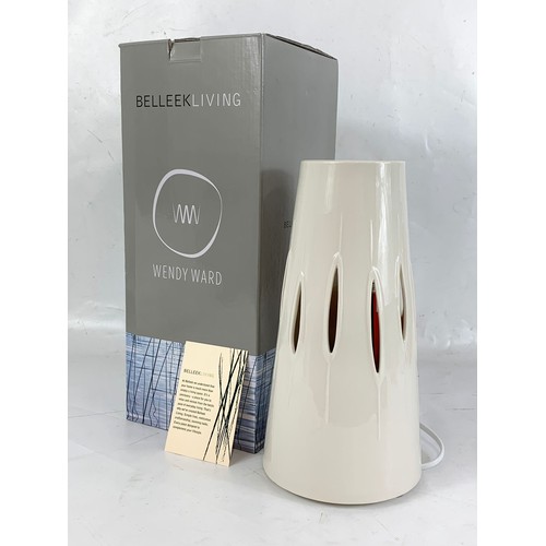 497 - A Belleek Living table lamp in box. Lamp measures 28cm