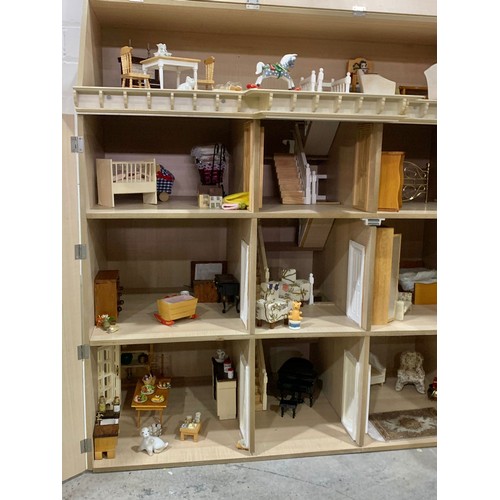 355a - A large wooden dolls house with a large quantity of furniture etc. 81.5 x 84cm