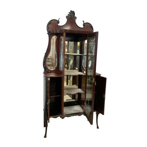 1031 - A late Victorian ornate mahogany display cabinet. Circa 1890-1900. 104.5 x 36 x 221cm.