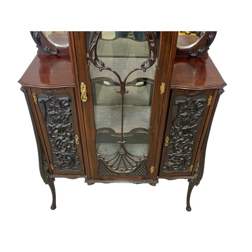 1031 - A late Victorian ornate mahogany display cabinet. Circa 1890-1900. 104.5 x 36 x 221cm.