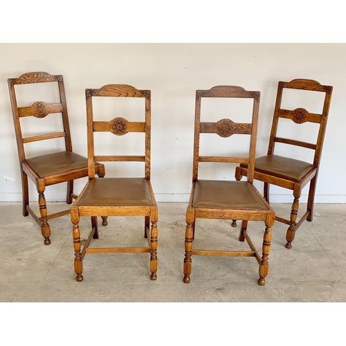 304 - A set of 4 vintage oak chairs.