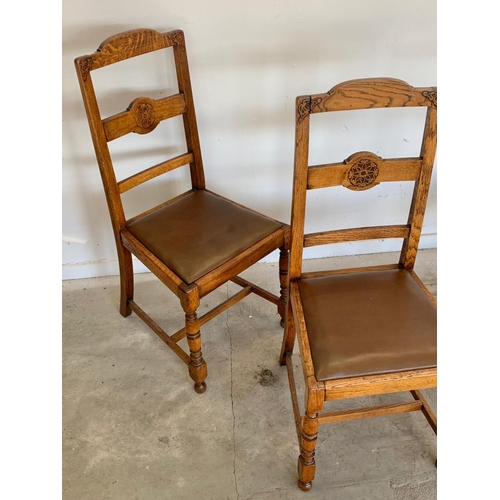 304 - A set of 4 vintage oak chairs.