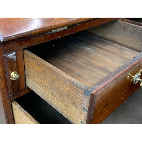 815 - A large Georgian mahogany writing bureau with brass drop handles. Circa 1760-80. 102.5 x 56.5 x 109.... 