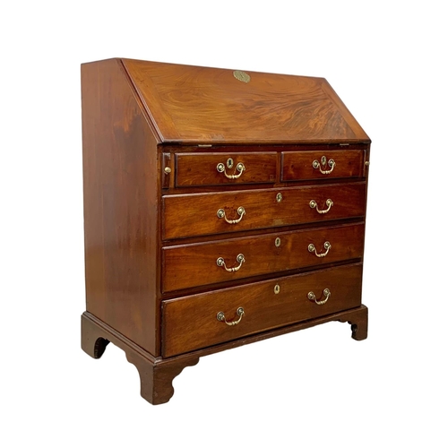 815 - A large Georgian mahogany writing bureau with brass drop handles. Circa 1760-80. 102.5 x 56.5 x 109.... 